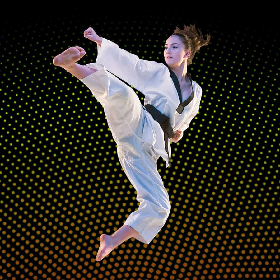 Martial Arts Lessons for Adults in Wentzville MO - Girl Black Belt Jumping High Kick